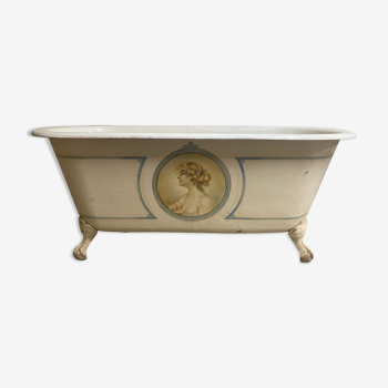 Late nineteenth cast iron bathtub, lion's feet, portrait signed h. charrier