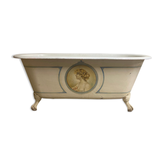 Late nineteenth cast iron bathtub, lion's feet, portrait signed h. charrier