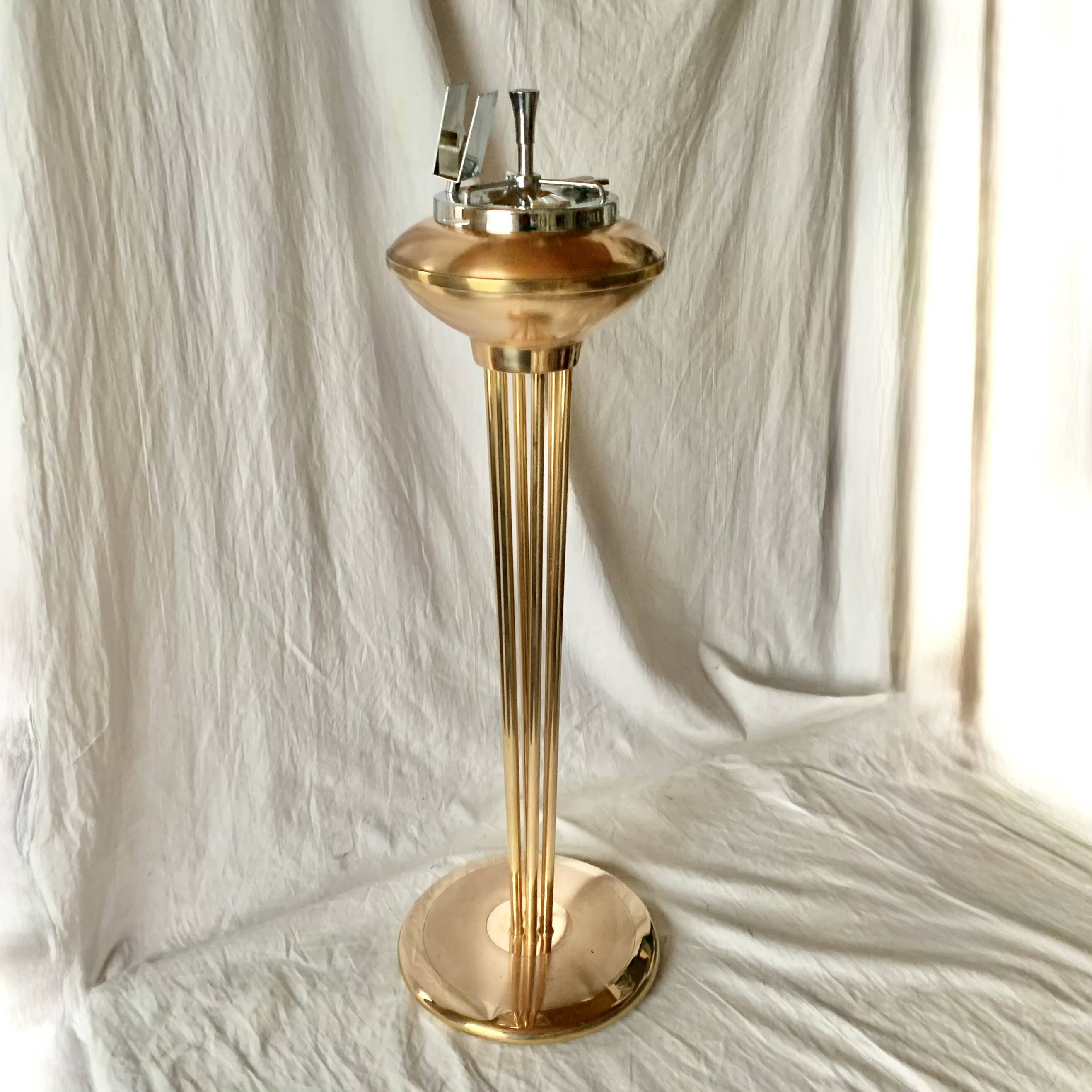 Old brass and chrome-plated metal ashtray on stand