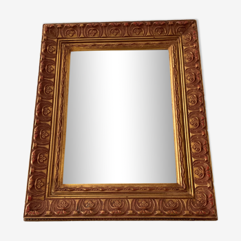 Old Beveled mirror in gilded wood