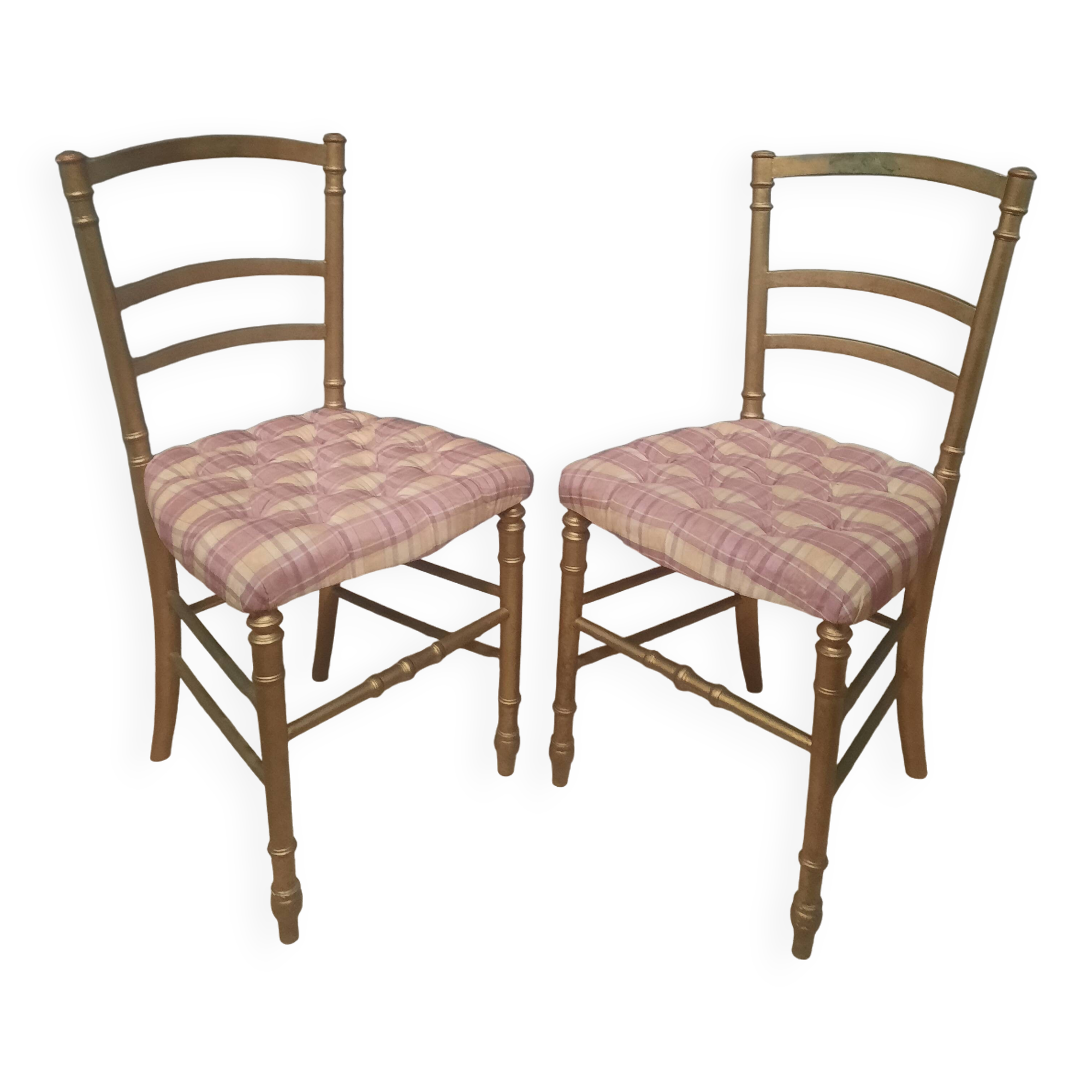 Pair of upholstered chairs in gilded wood