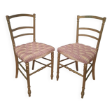 Pair of upholstered chairs in gilded wood