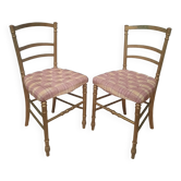 Pair of upholstered chairs in gilded wood