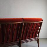 Dark rattan 3-seater sofa with red velour cushions | 1980s