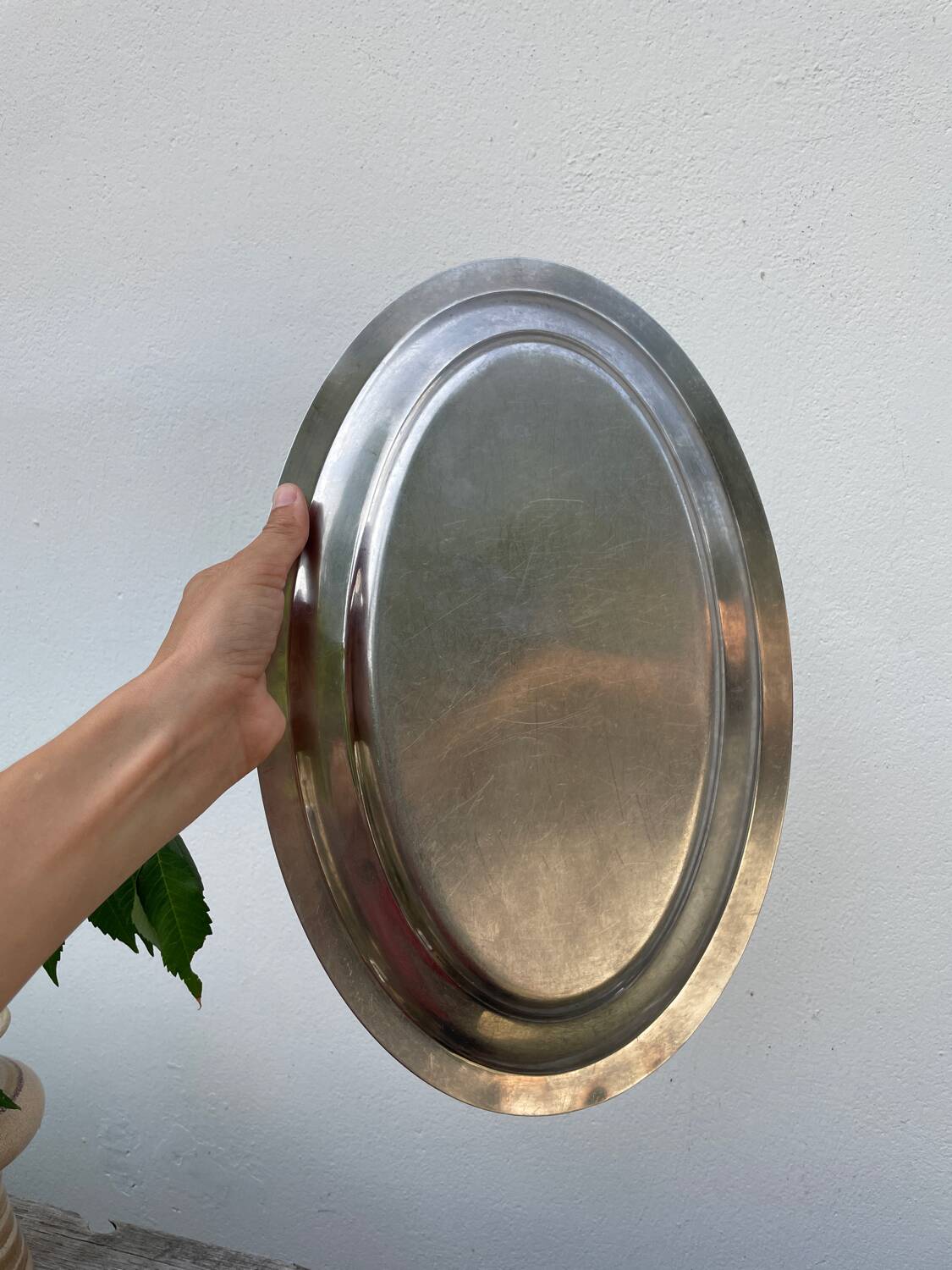 Oval stainless steel dish, signed Rémi Letang