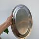 Oval stainless steel dish, signed Rémi Letang