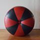 Vintage round pouf in red and black Skai