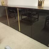 Black lacquered and brass design 70/80