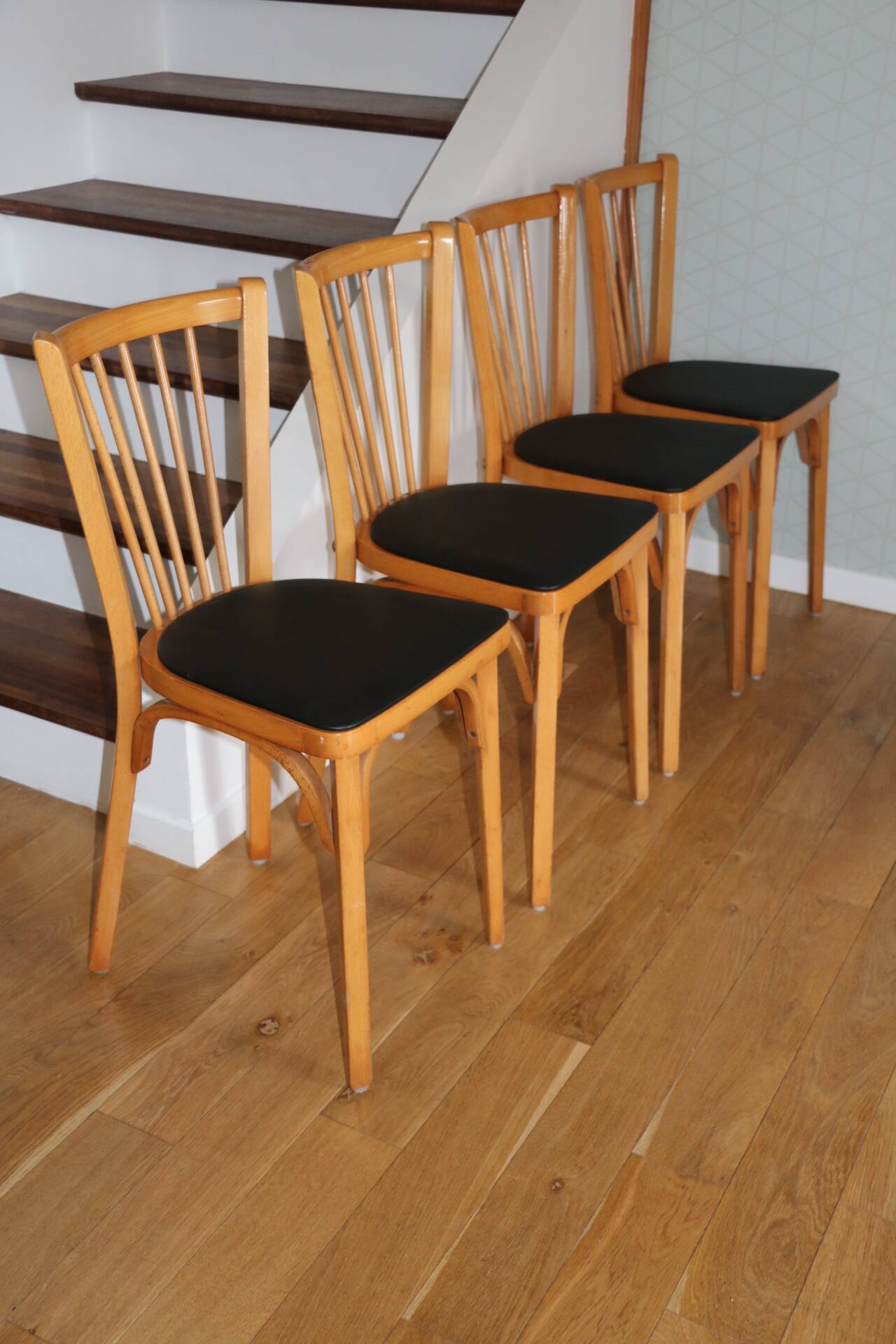 4 BAUMANN N°12 chairs in black skai and light beech
