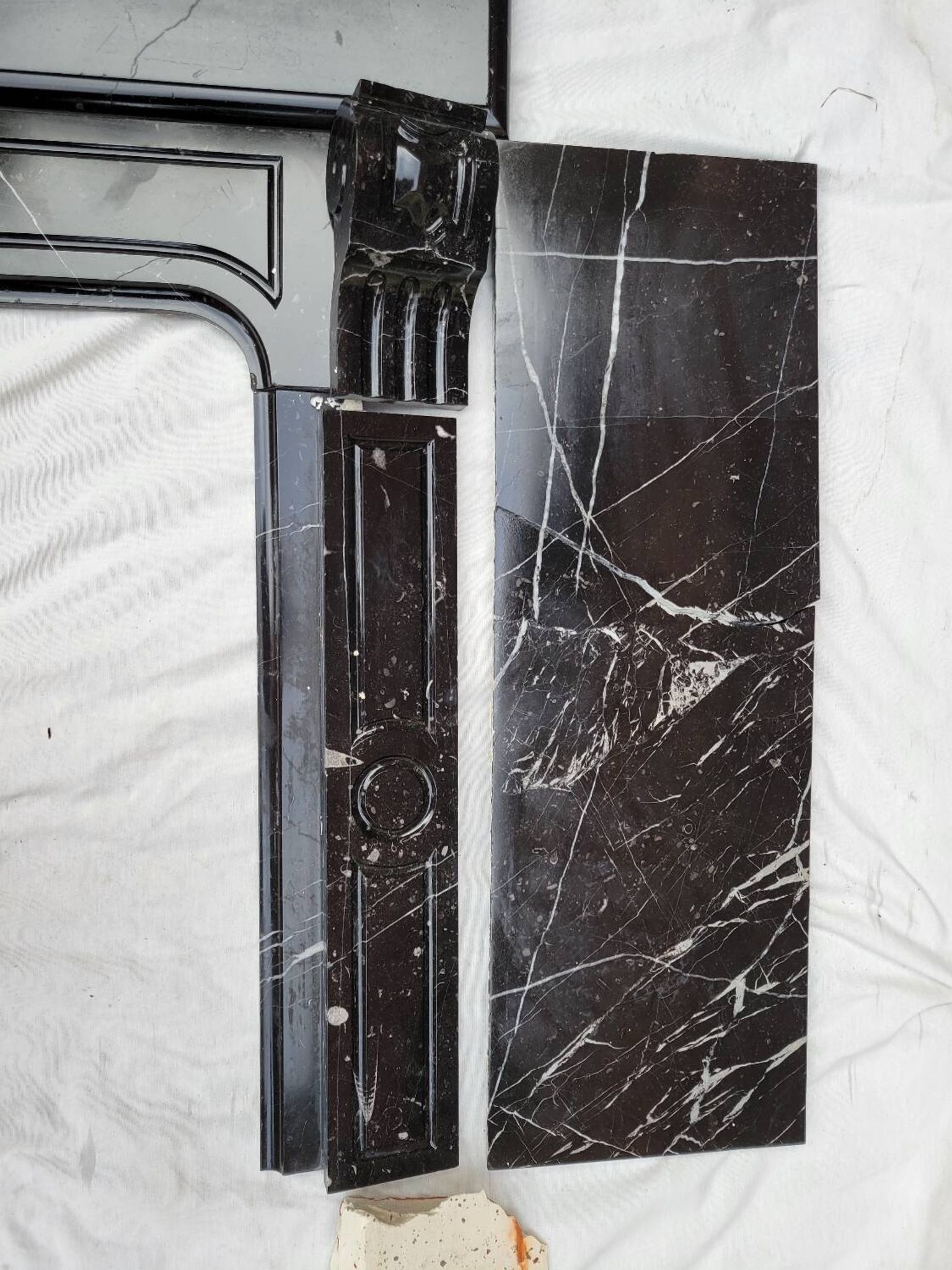 Pompadour fireplace with black marble modillions