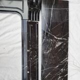 Pompadour fireplace with black marble modillions