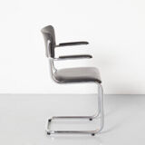 Tubax cantilever chair with black armrest