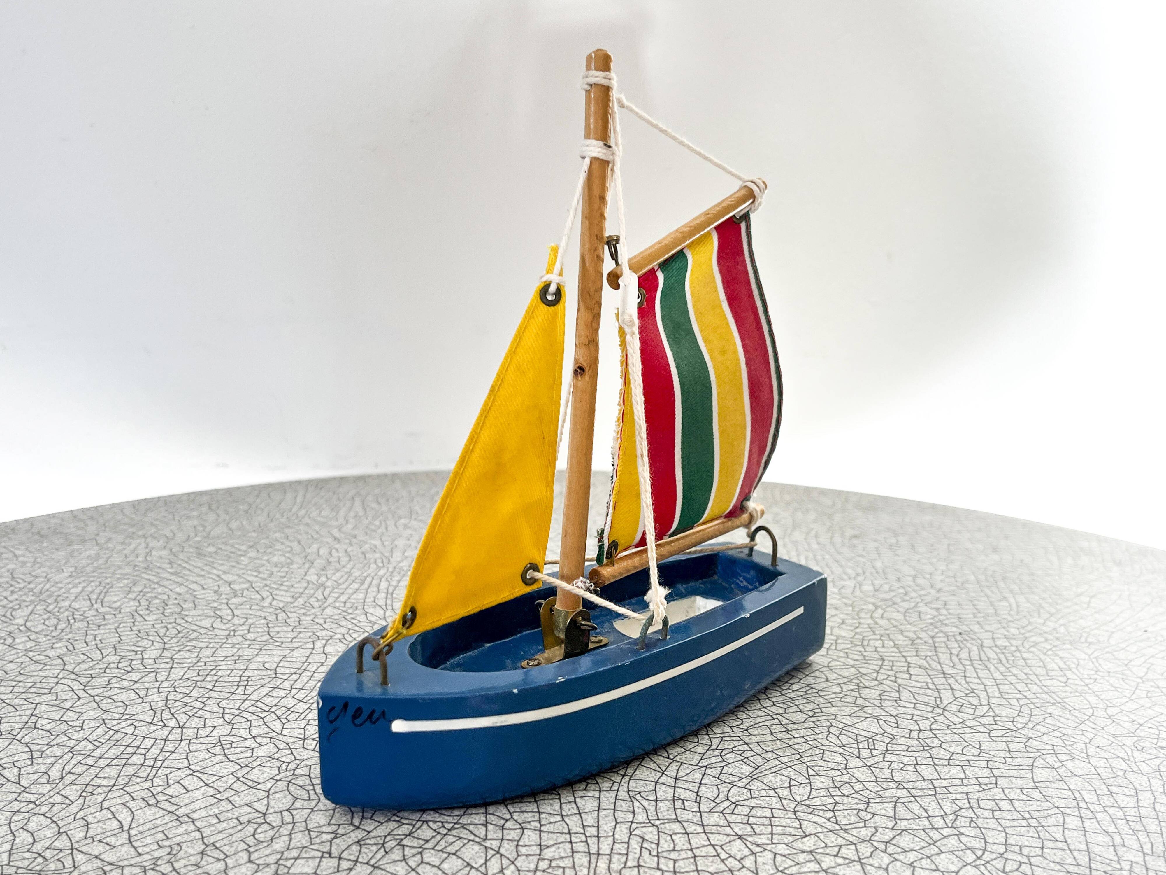 Wooden bathtub sailboat, perhaps a Tirot.