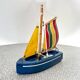 Wooden bathtub sailboat, perhaps a Tirot.