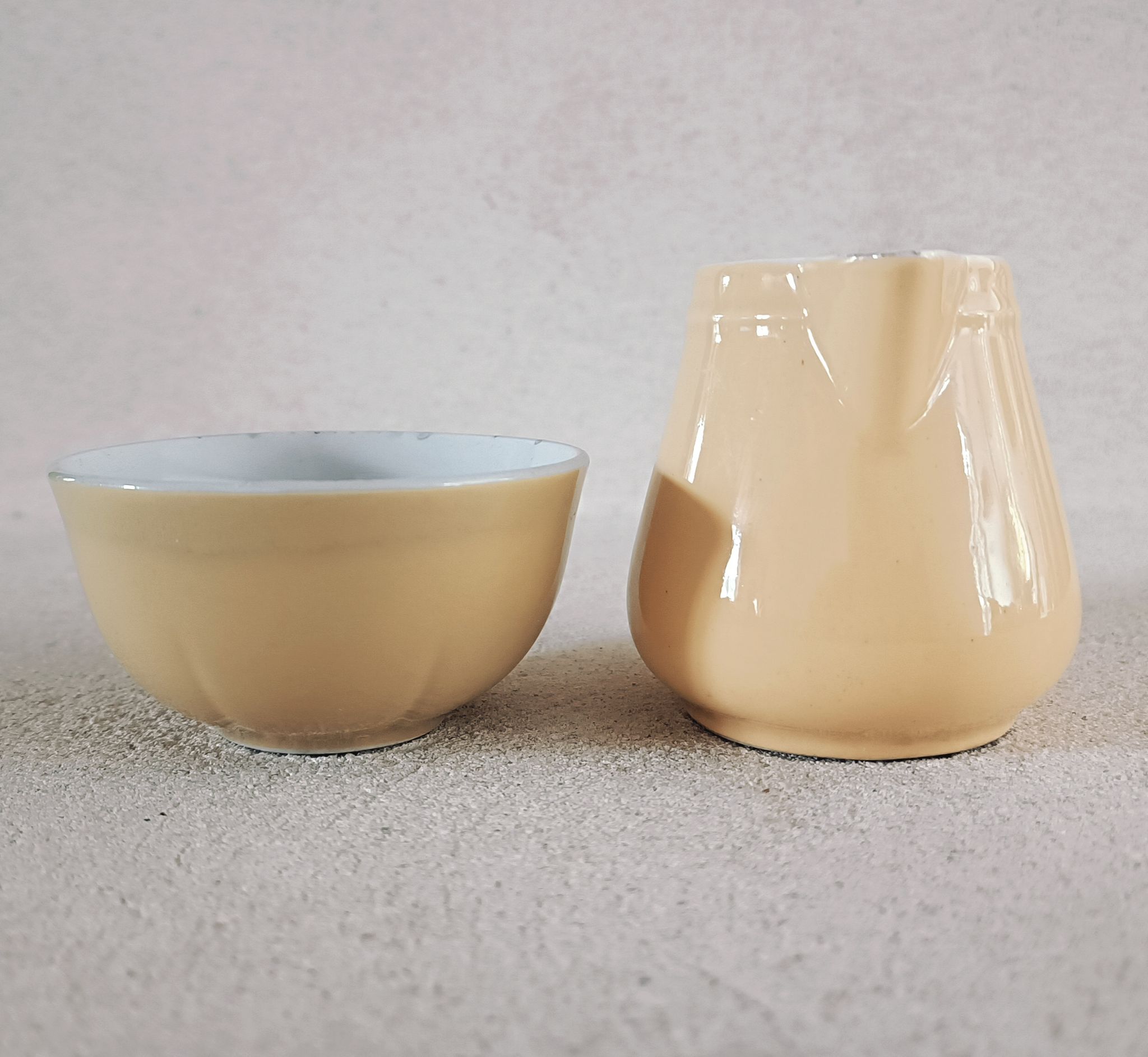 Earthenware cup and milk jar
