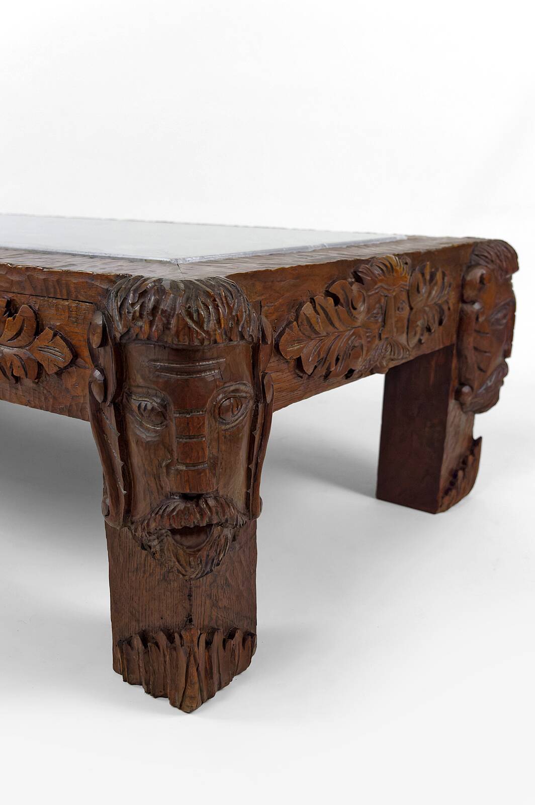 Solid oak coffee table carved with fauns and gray marble top, France, circa 1940