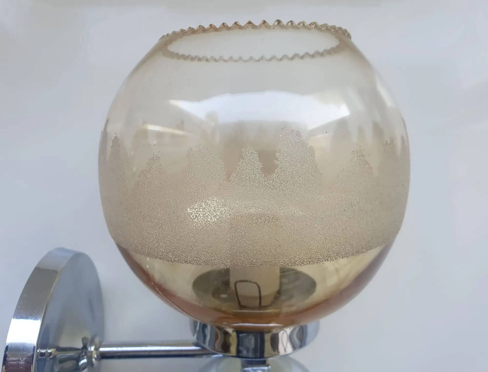Pair of chrome metal wall lights with vintage sandblasted glass globes