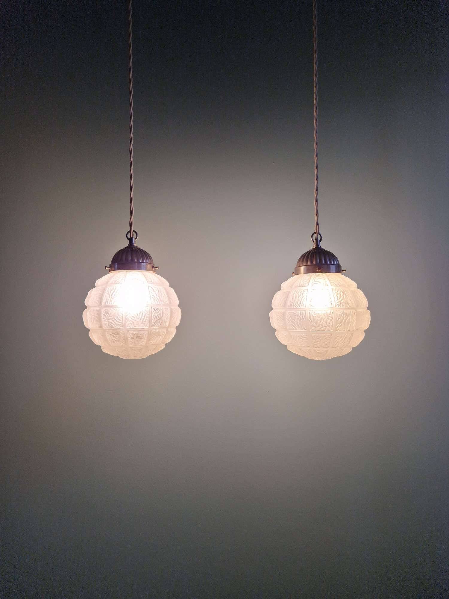 Pair of Art Deco frosted glass pendants, 1920s-30s.