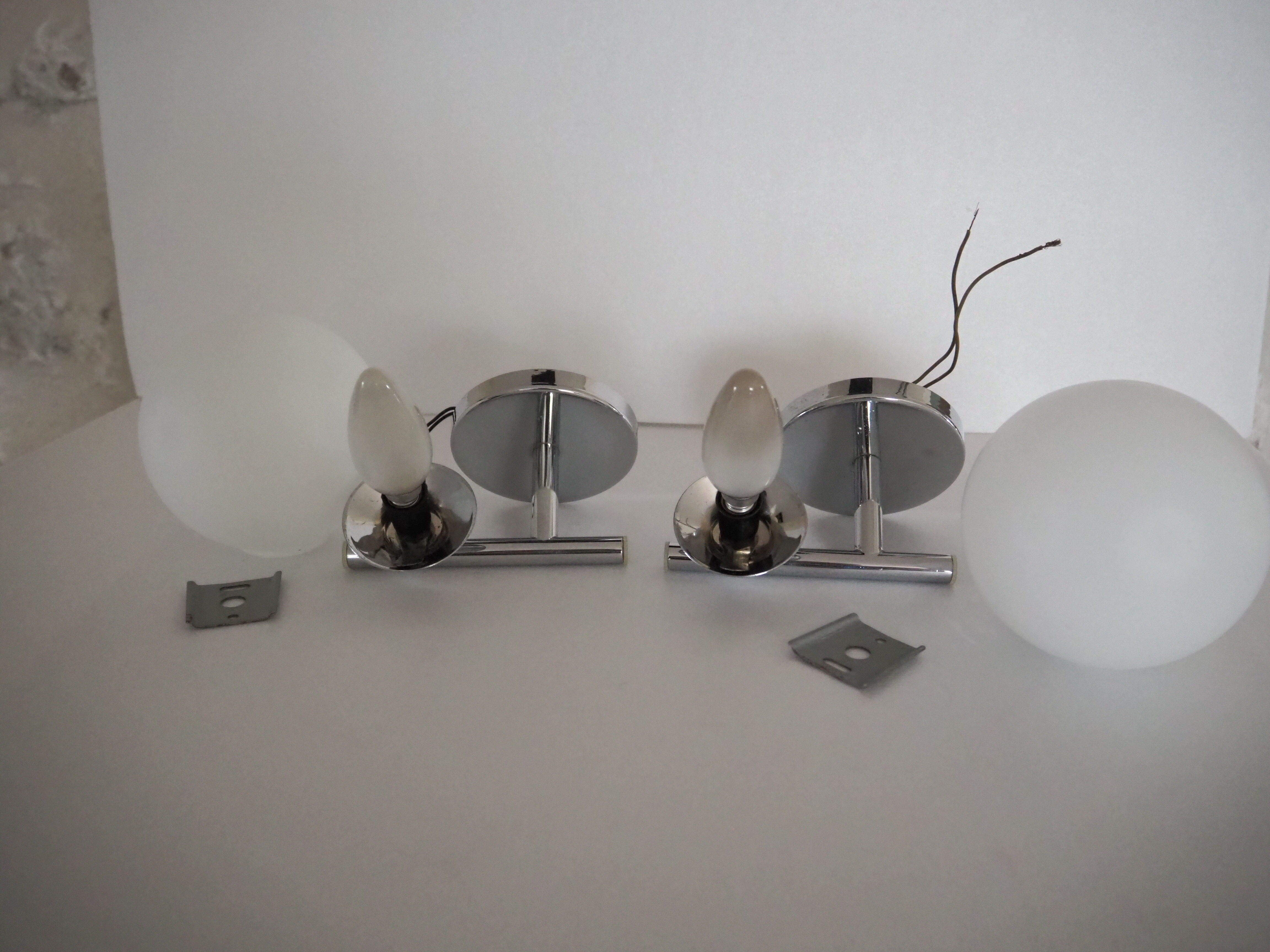Pair of sconces with an opaline globe and chrome structure from the 1970s