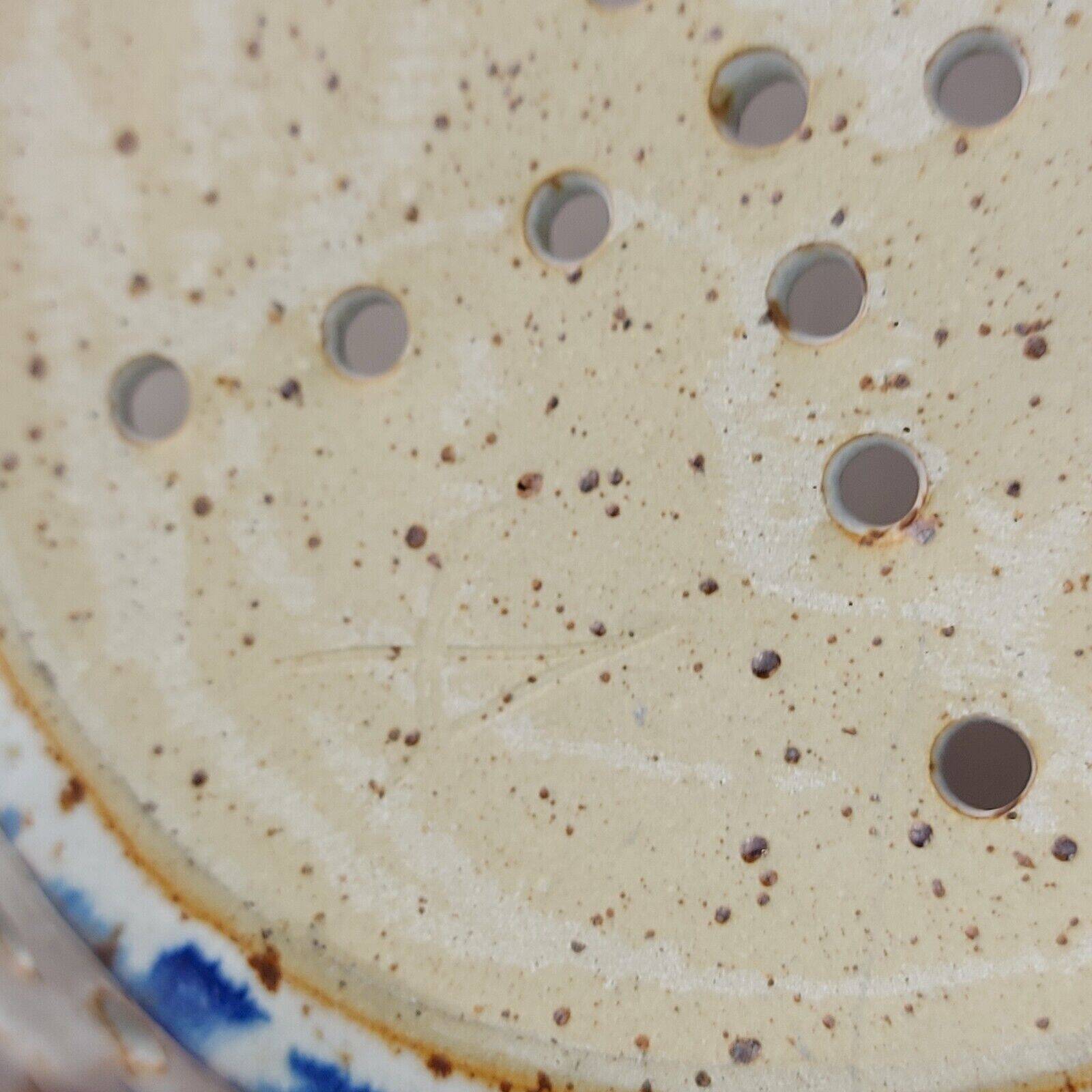 Old stoneware colander