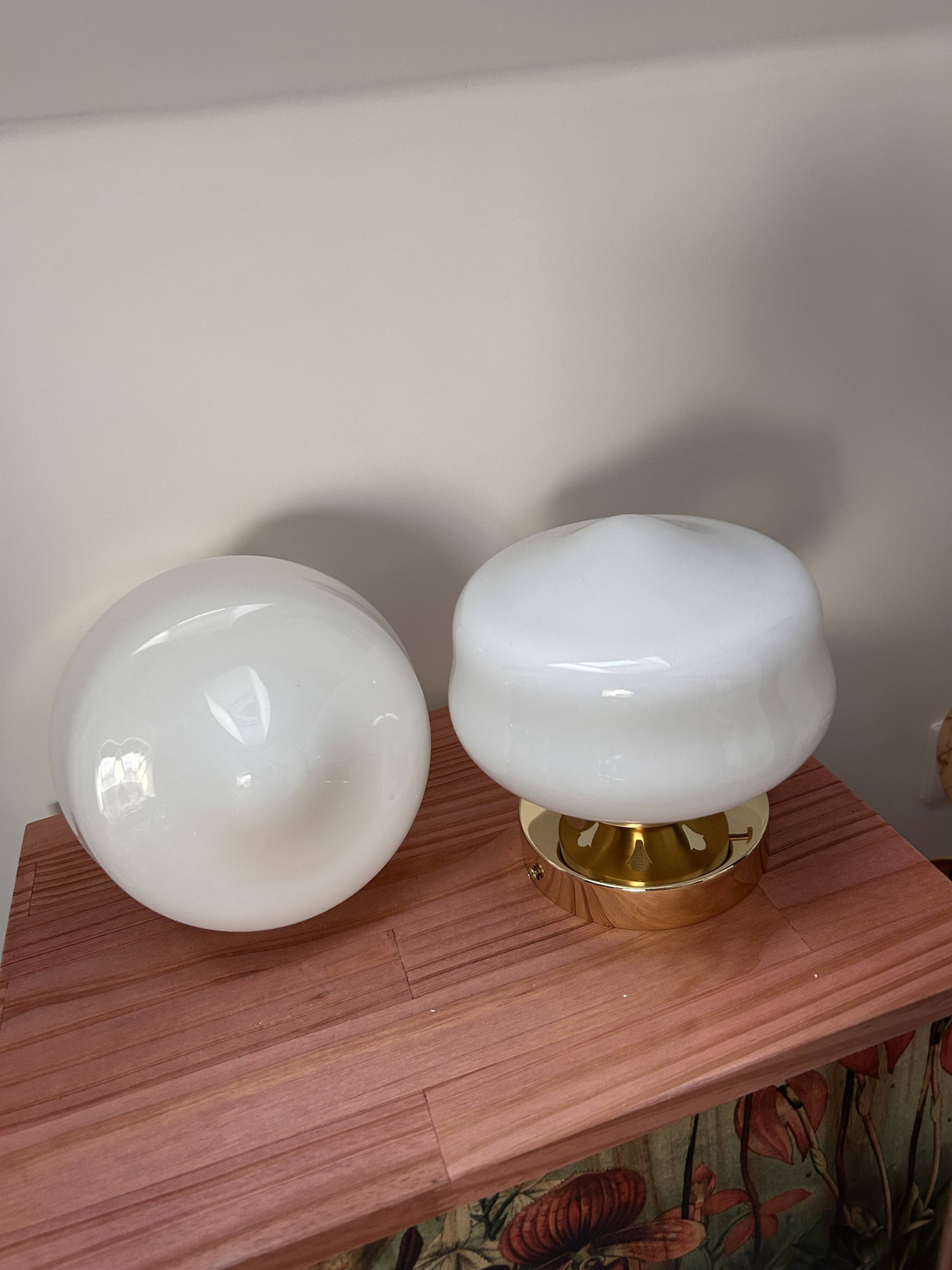 Pair of white opaline globe wall lights