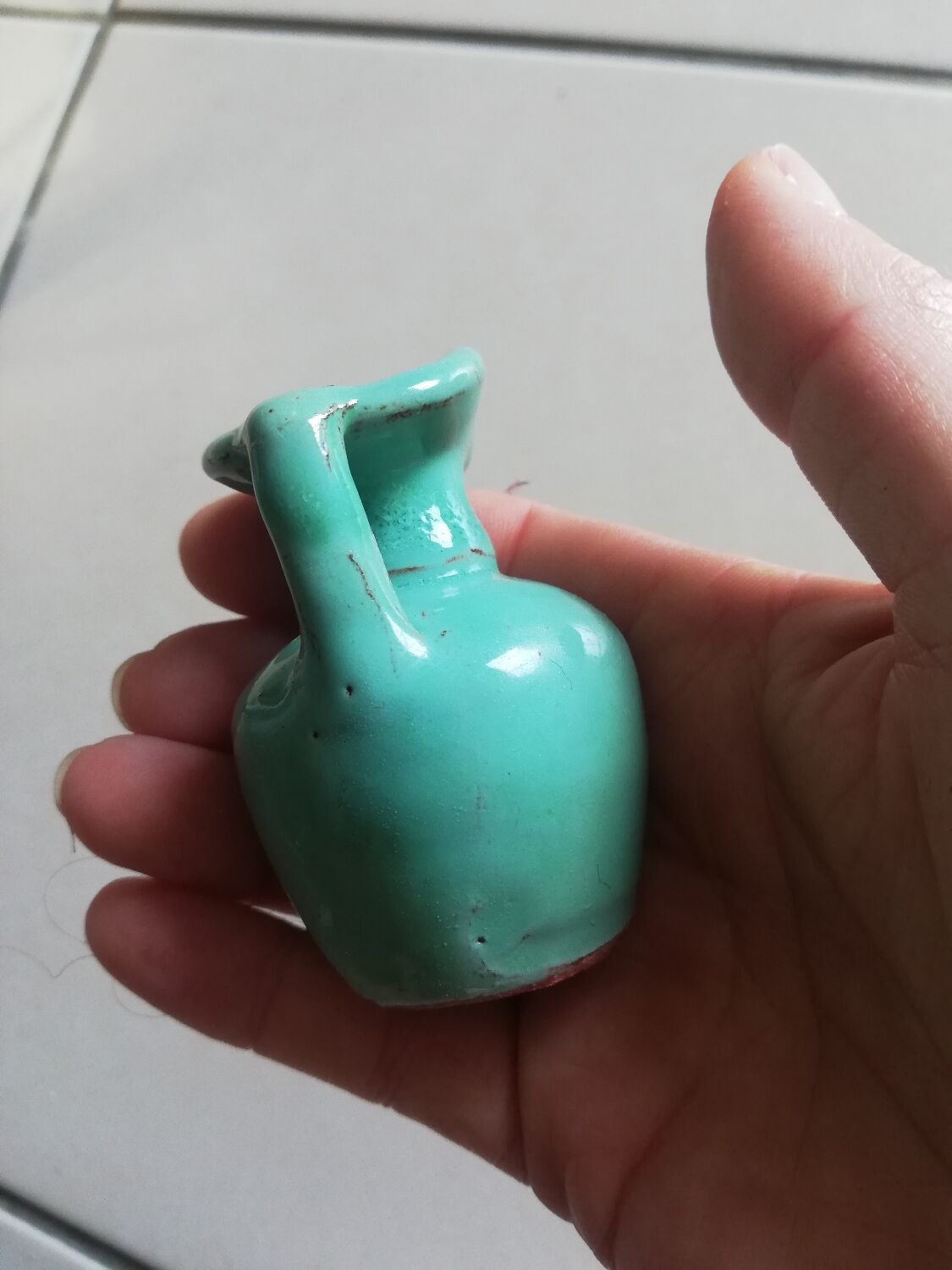 Very small turquoise soliflore in the shape of a ceramic jug