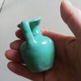 Very small turquoise soliflore in the shape of a ceramic jug