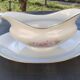 Vintage fine porcelain sauce boat with gold gilding.