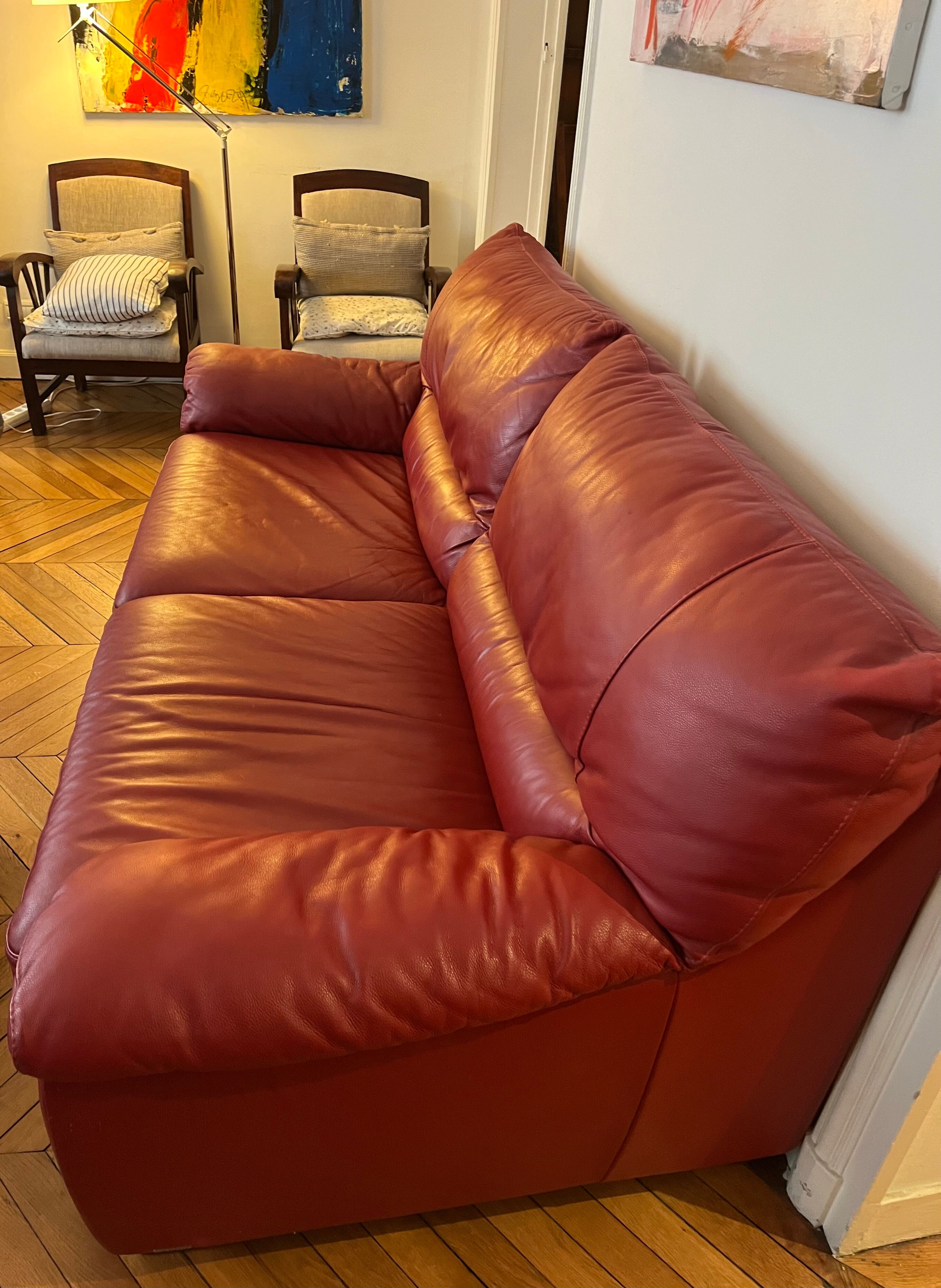 Set convertible leather sofa and footrest Natuzzi