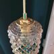 Moulded glass lamp with a cubic-spherical relief design.