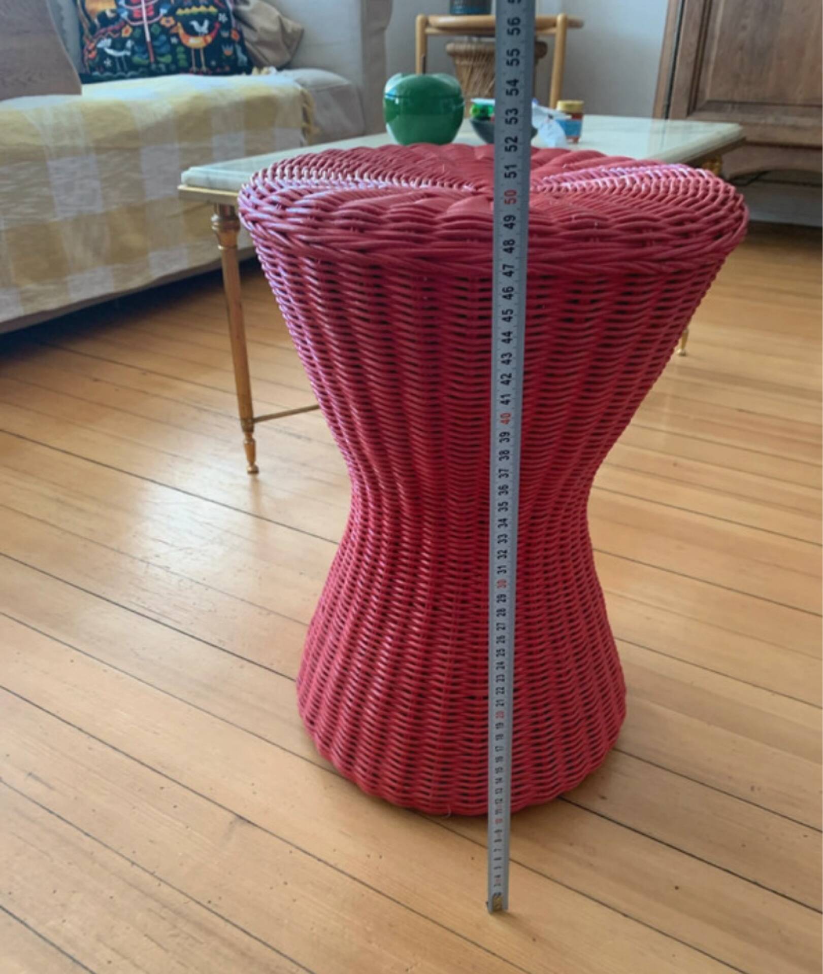 Vintage hourglass stool in red wicker or woven rattan.