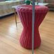 Vintage hourglass stool in red wicker or woven rattan.