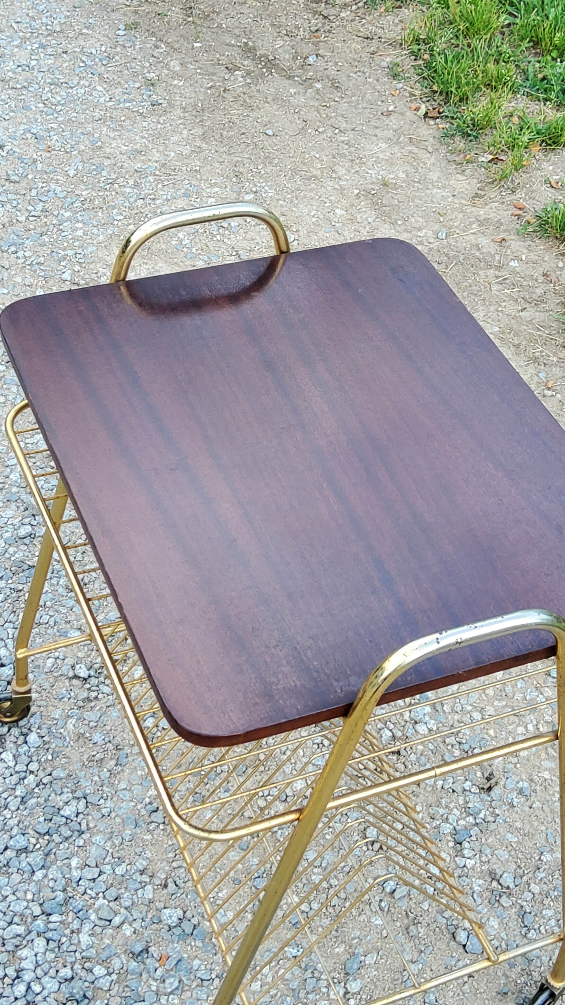 Side table of the 60s mahogany and gold metal range discs