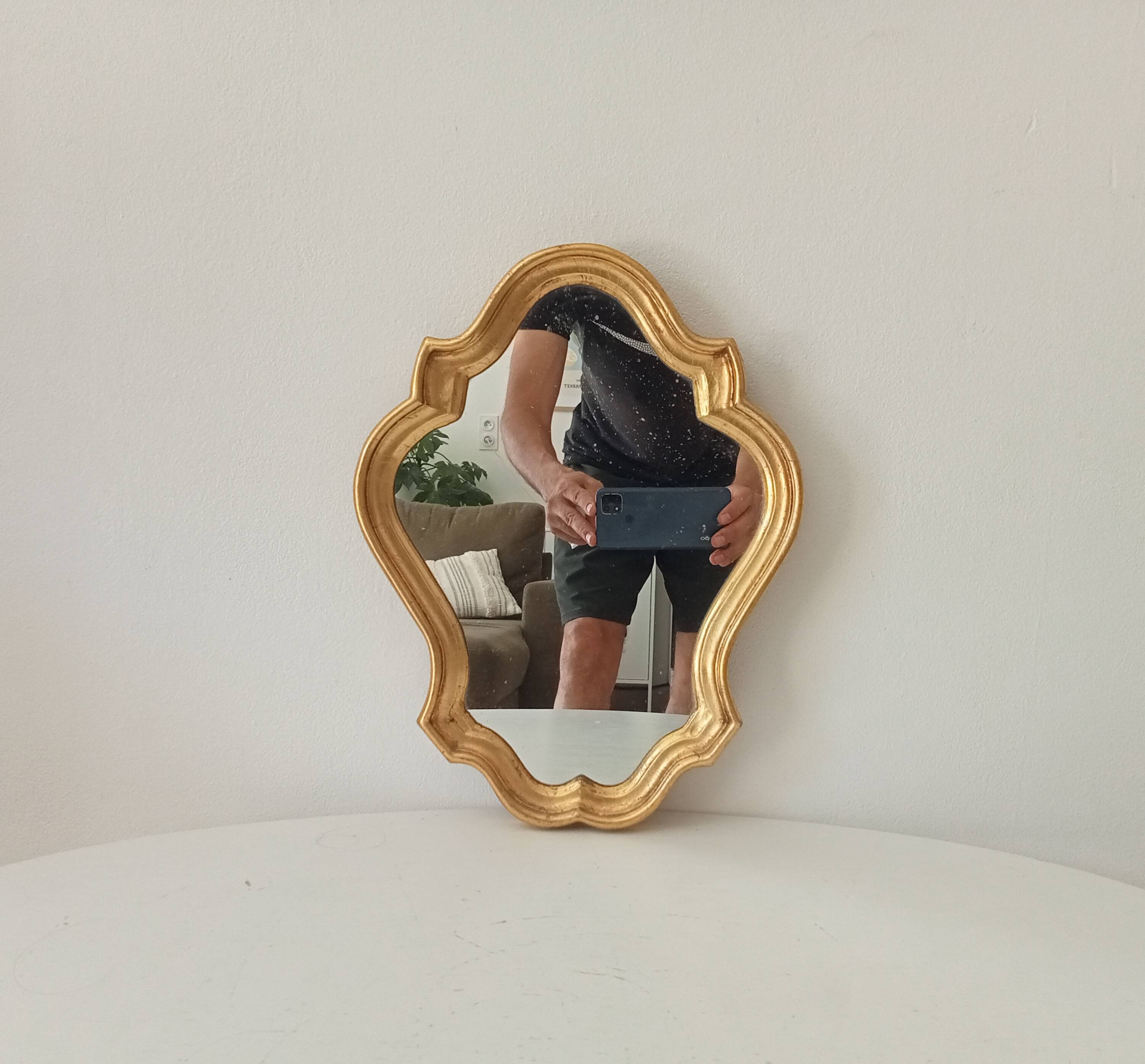 Baroque mirror in gilded wood from the 1960s.