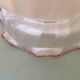 Peach-colored transparent glass collar globe