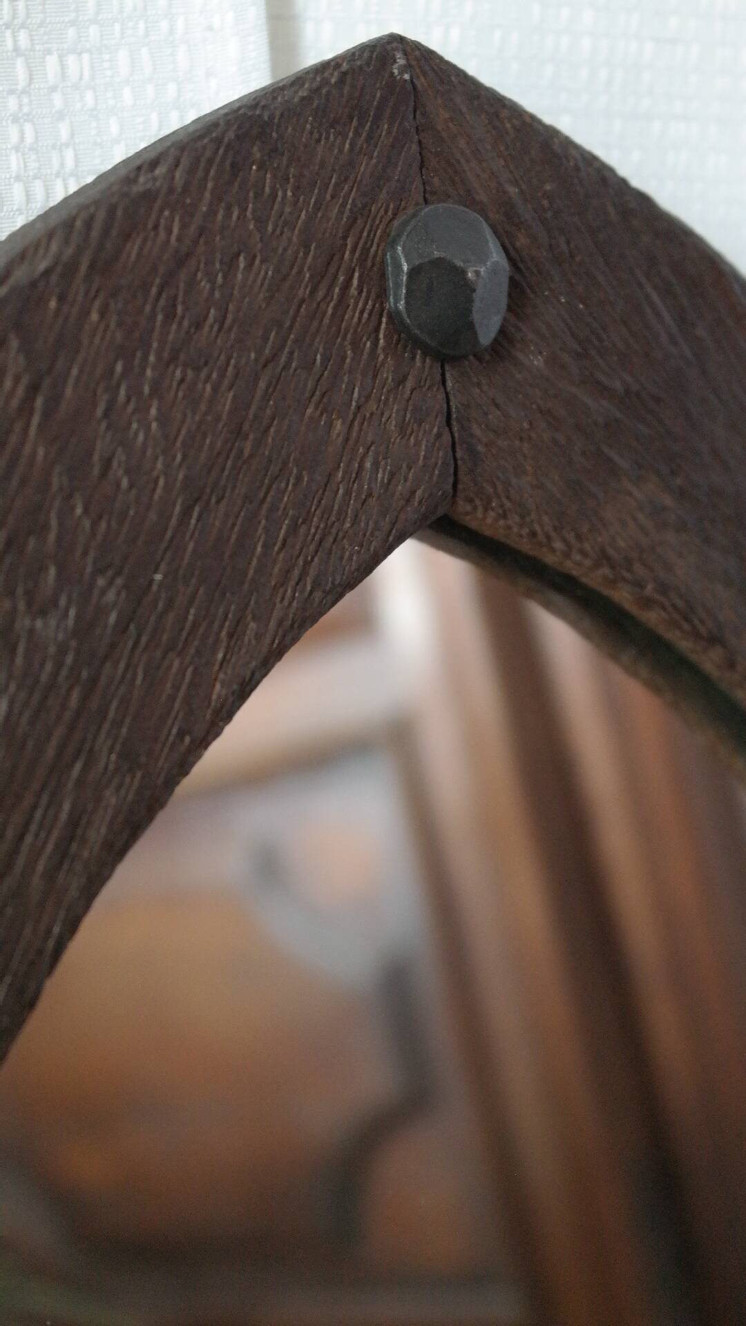 Old handcrafted Gothic style wooden mirror