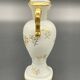 Small amphora vase in Limoges porcelain with gilded handles.