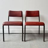 Pair of vintage stacking chairs with red vinyl upholstery