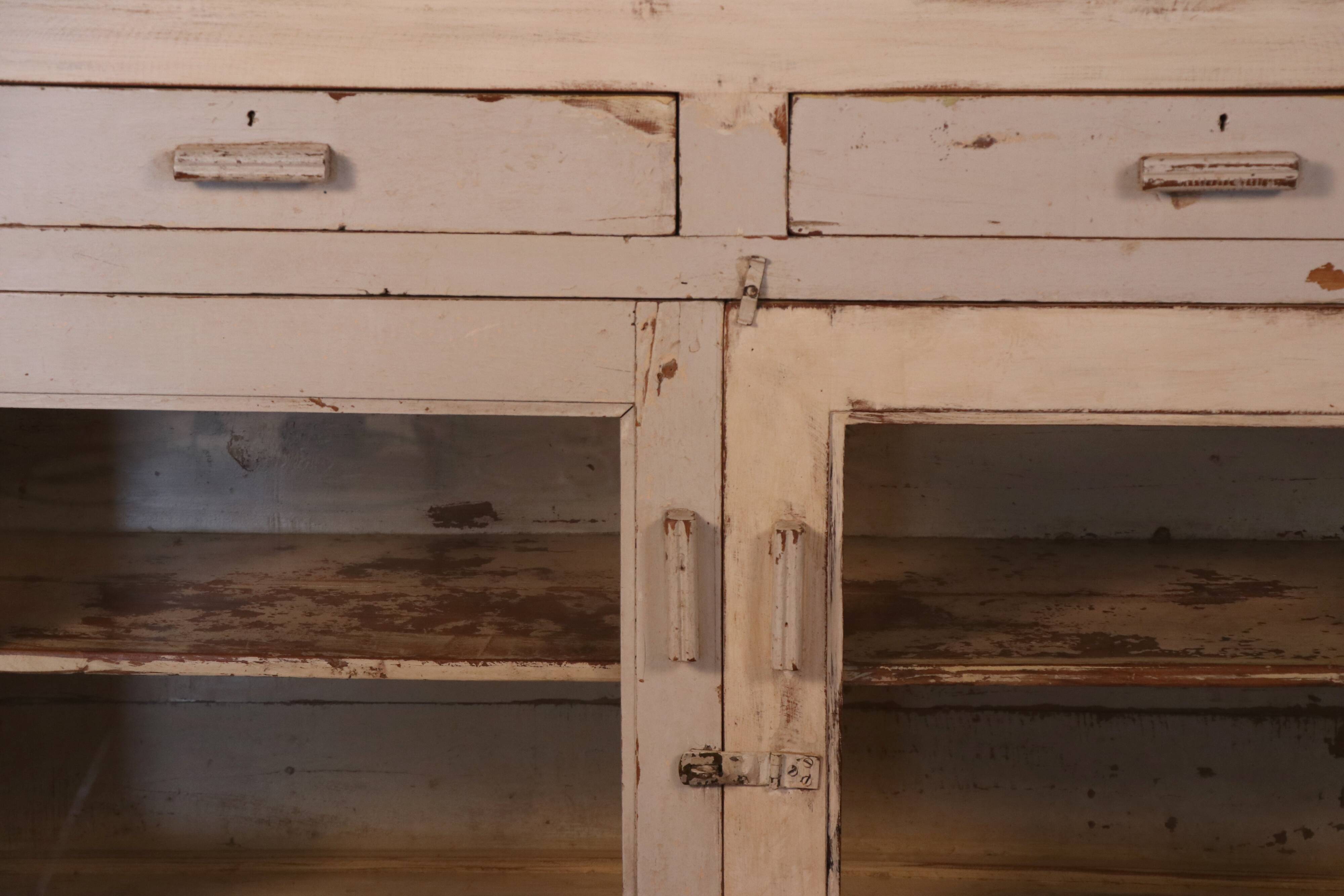 Merchant counter in Burmese teak with original white patina