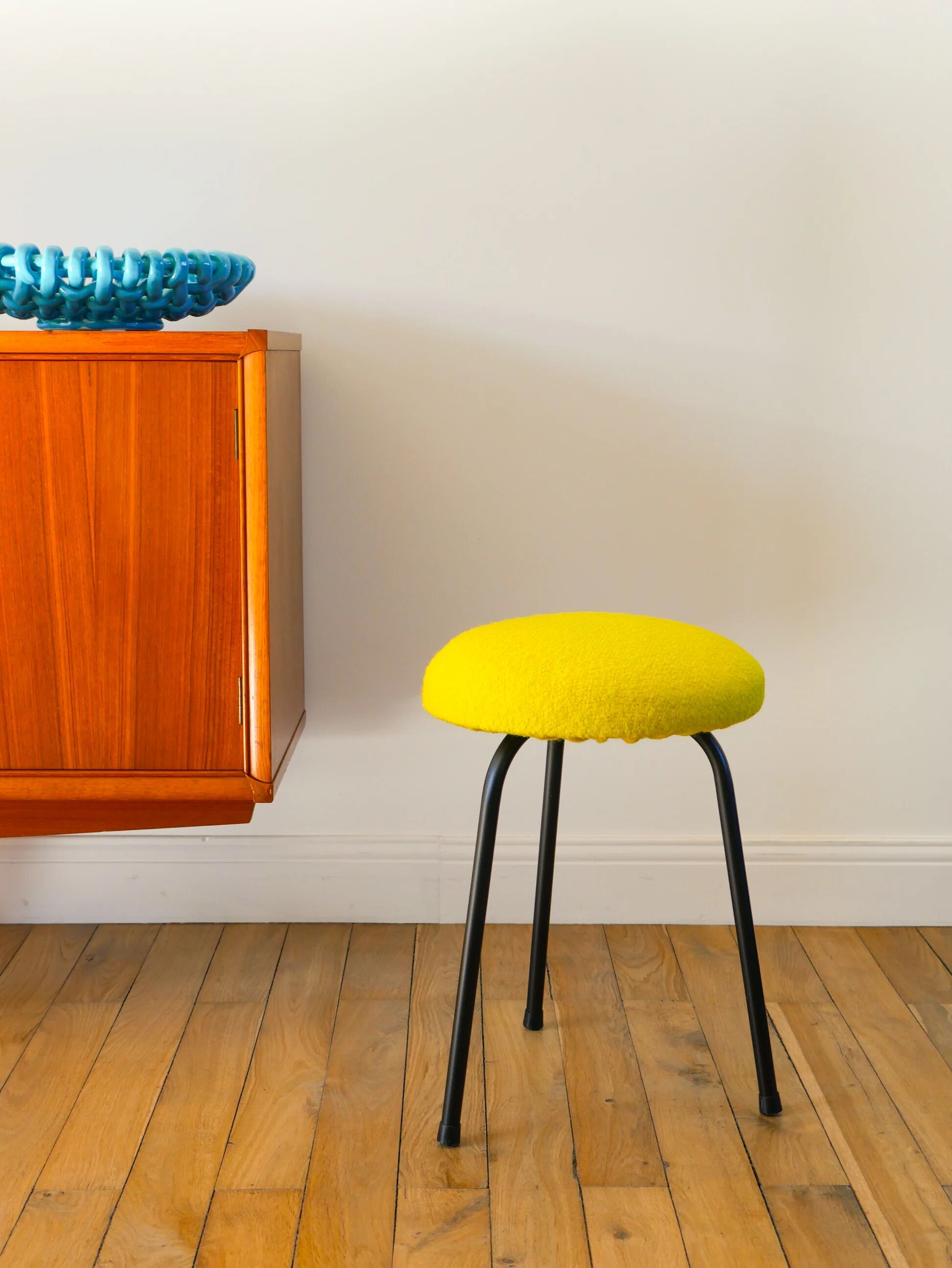 Black iron tripod stool with boiled wool, yellow, 1960.