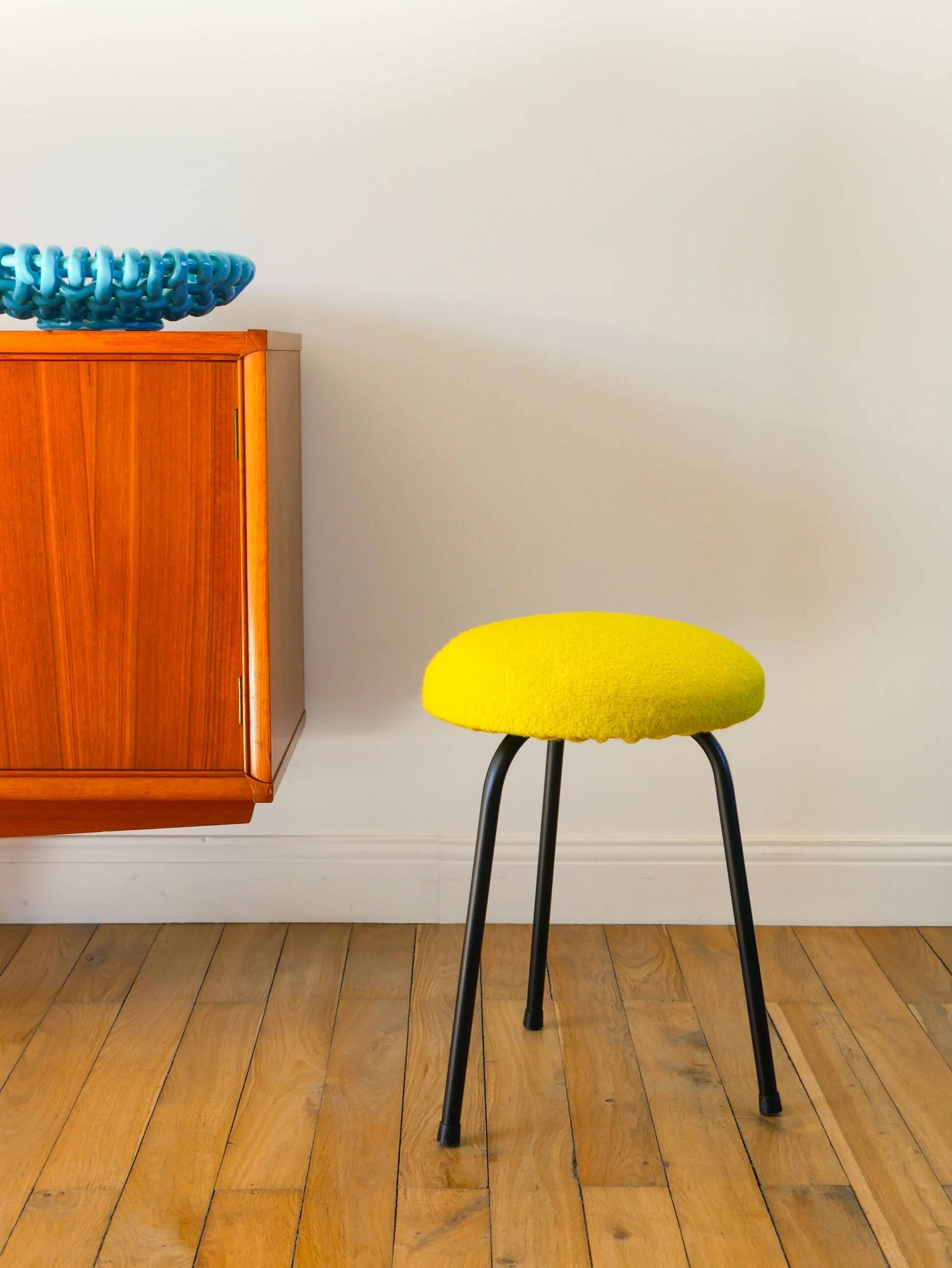 Black iron tripod stool with boiled wool, yellow, 1960.