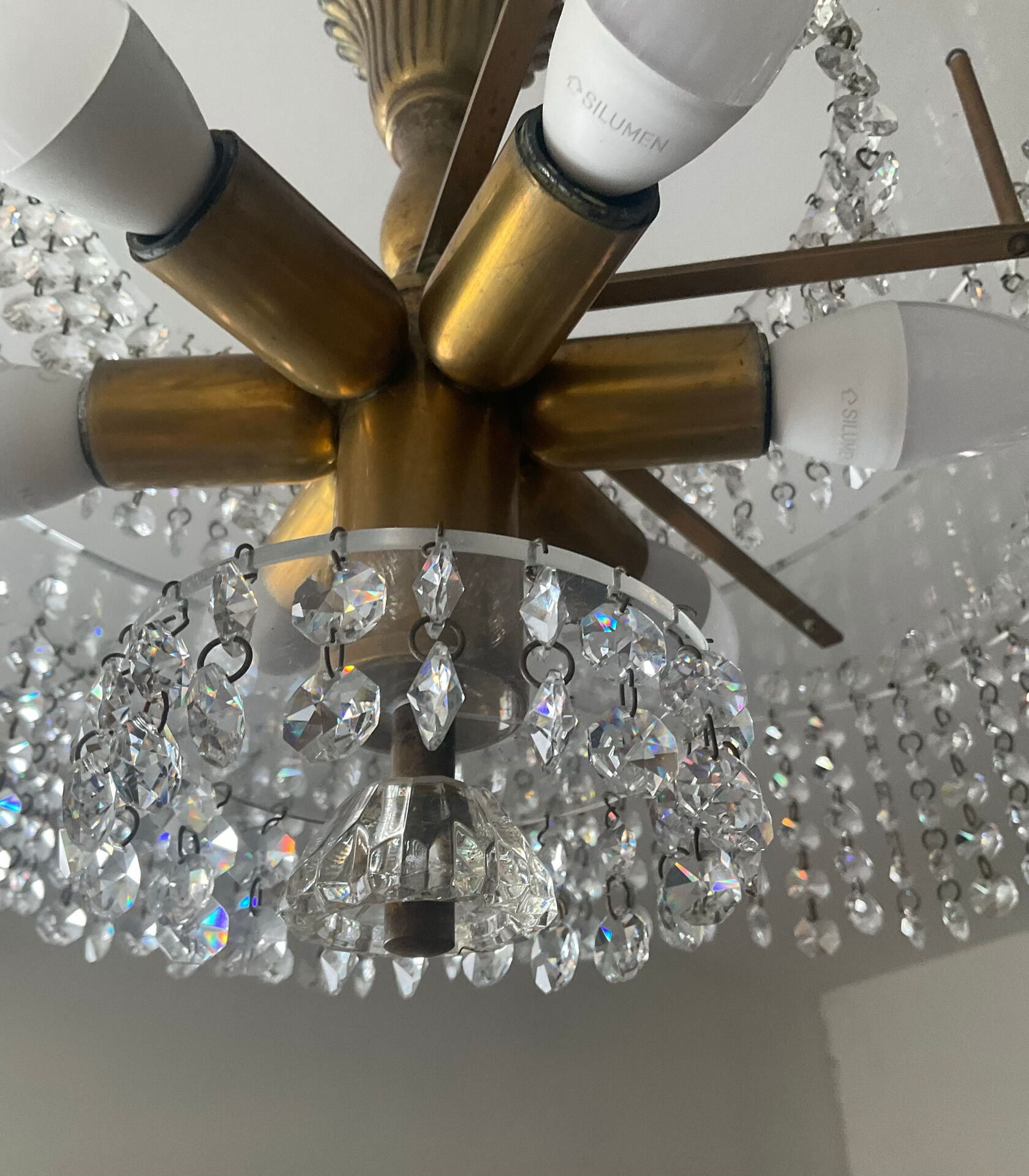 Vintage lucite chandelier with a cascade of crystal pendants from the 1970s.