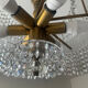 Vintage lucite chandelier with a cascade of crystal pendants from the 1970s.