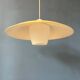 Danish mid-century suspension with opaline glass shade and yellow metal cover.