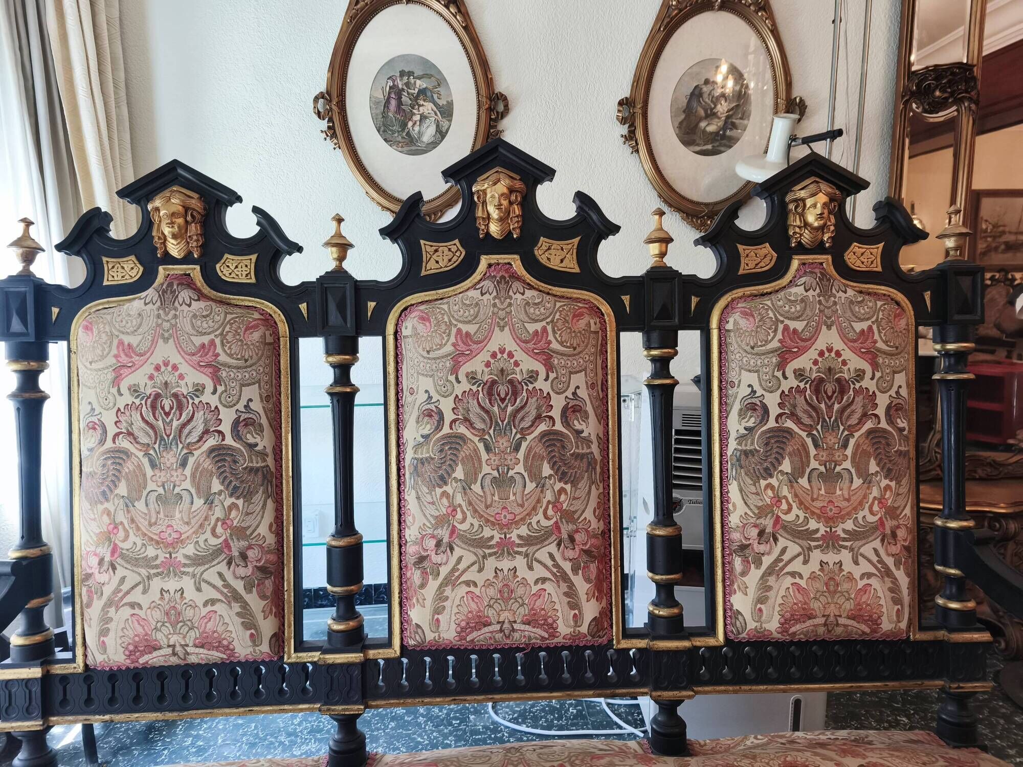 Historicist three-seater canapé in ebonised wood.