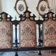 Historicist three-seater canapé in ebonised wood.