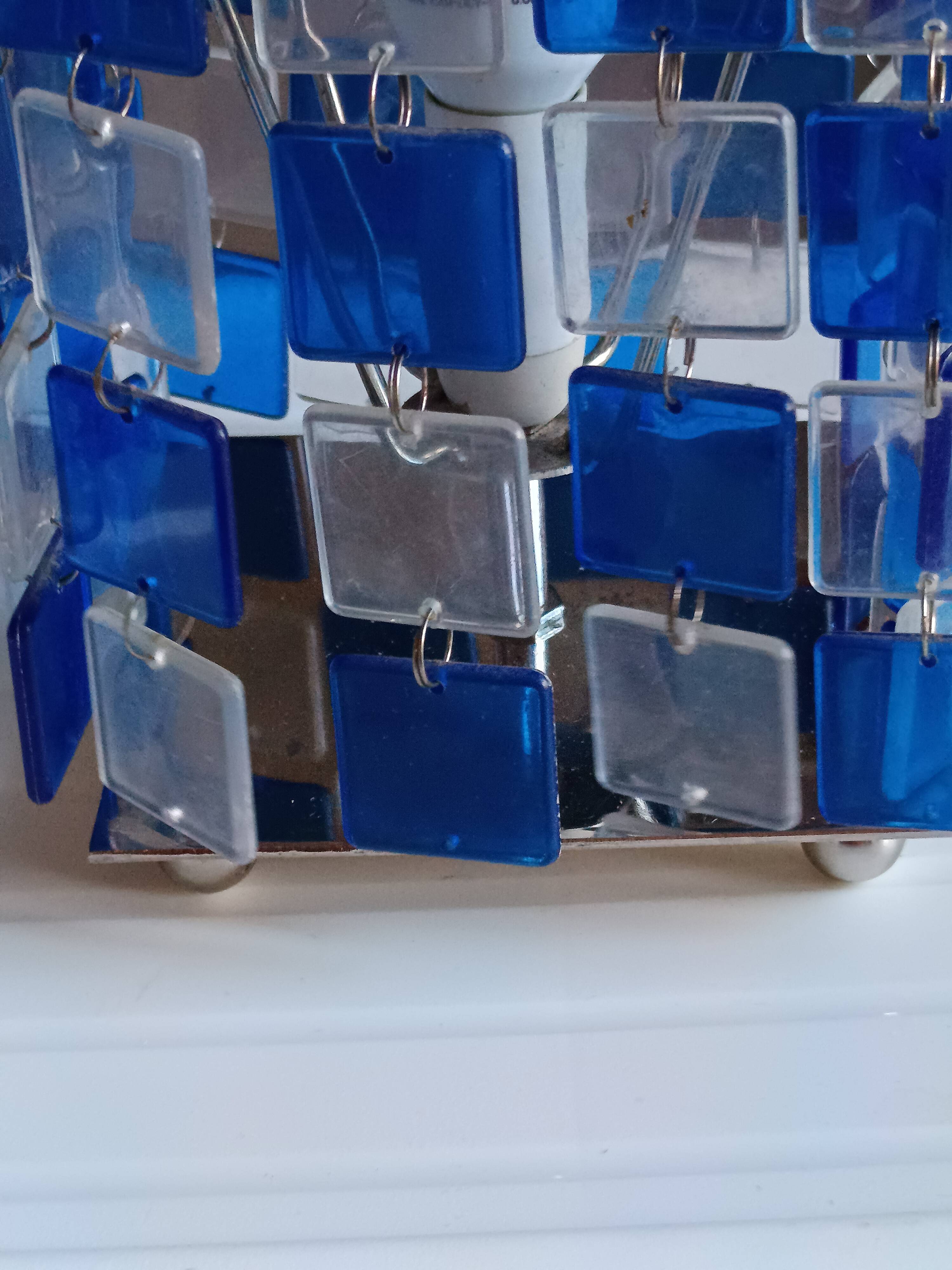 1970s designer table lamp with blue and clear plexiglass pendants.