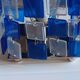 1970s designer table lamp with blue and clear plexiglass pendants.