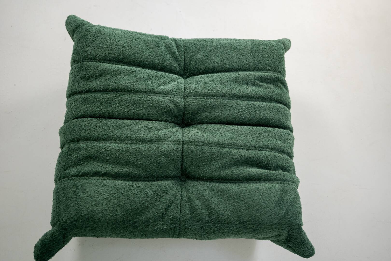 Togo set of armchair and pouf in emerald bucle