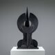 Abstract multilayered wooden sculpture with geometric shapes